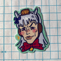 Sticker of a character with horse ears and a red bow on a grid background