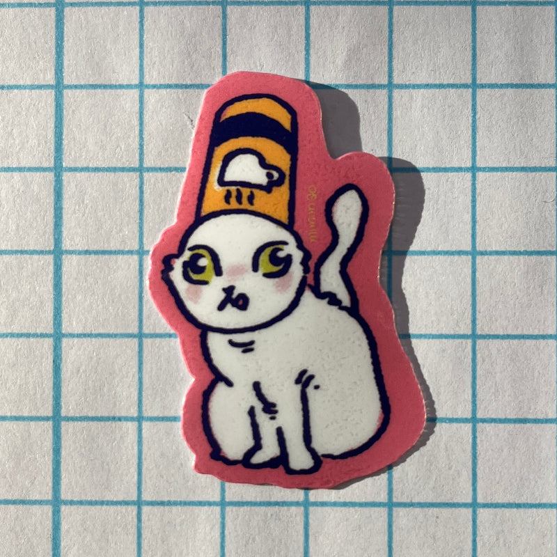Sticker of a cat with a yellow hat on a grid background
