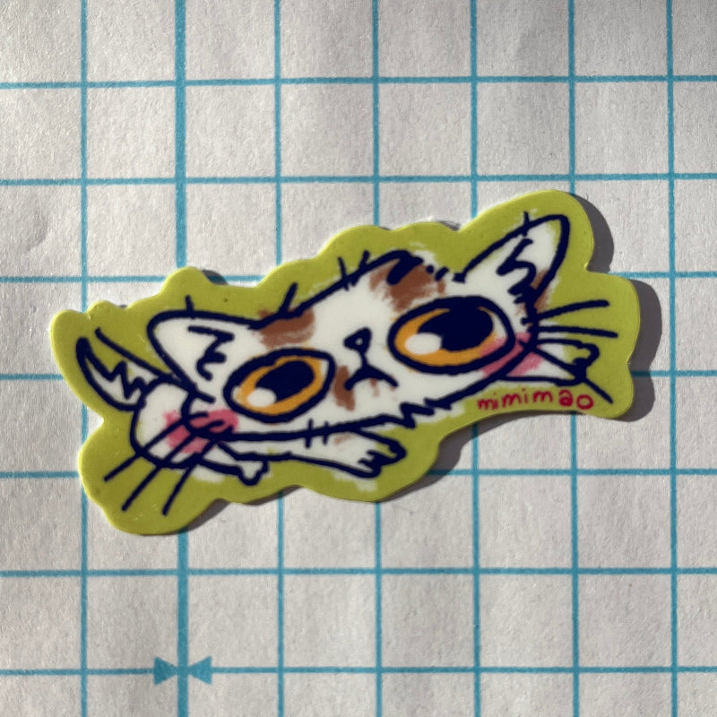 Cartoon cat sticker on grid paper