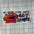 Sticker with Elmo and text 'Elmo says Gay Rights' on a grid background