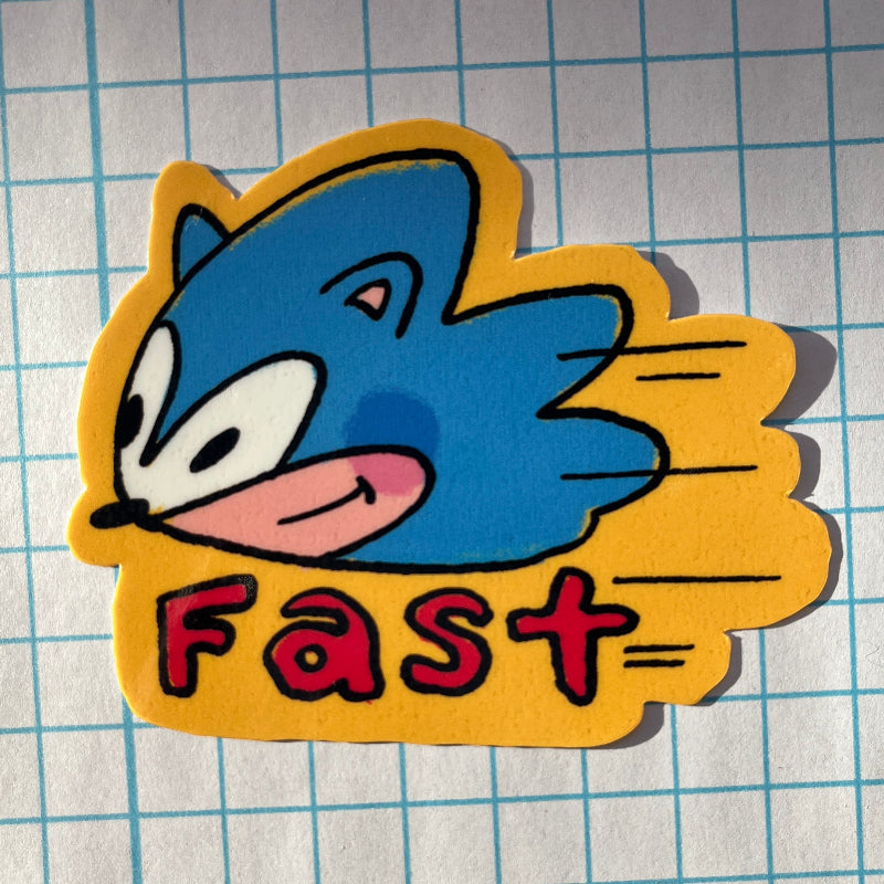 Cartoon character sticker with 'Fast' text on a grid background