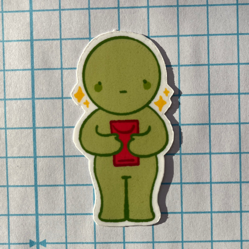 Green cartoon character holding a red object on a grid background