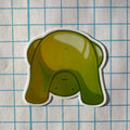 Green cartoon elephant sticker on a grid background