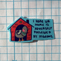 Sticker with a birdhouse and text on a grid background