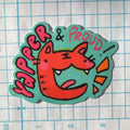 Sticker with a fox design and text 'Vaper & Proud' on a grid background
