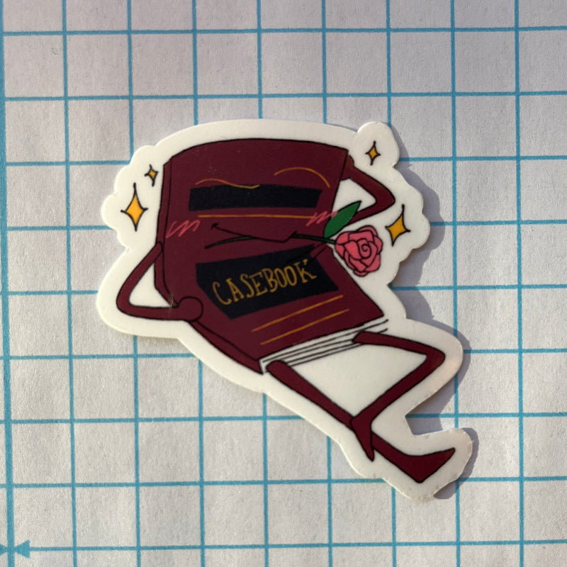 Sticker of a book titled 'CASEBOOK' on a grid background