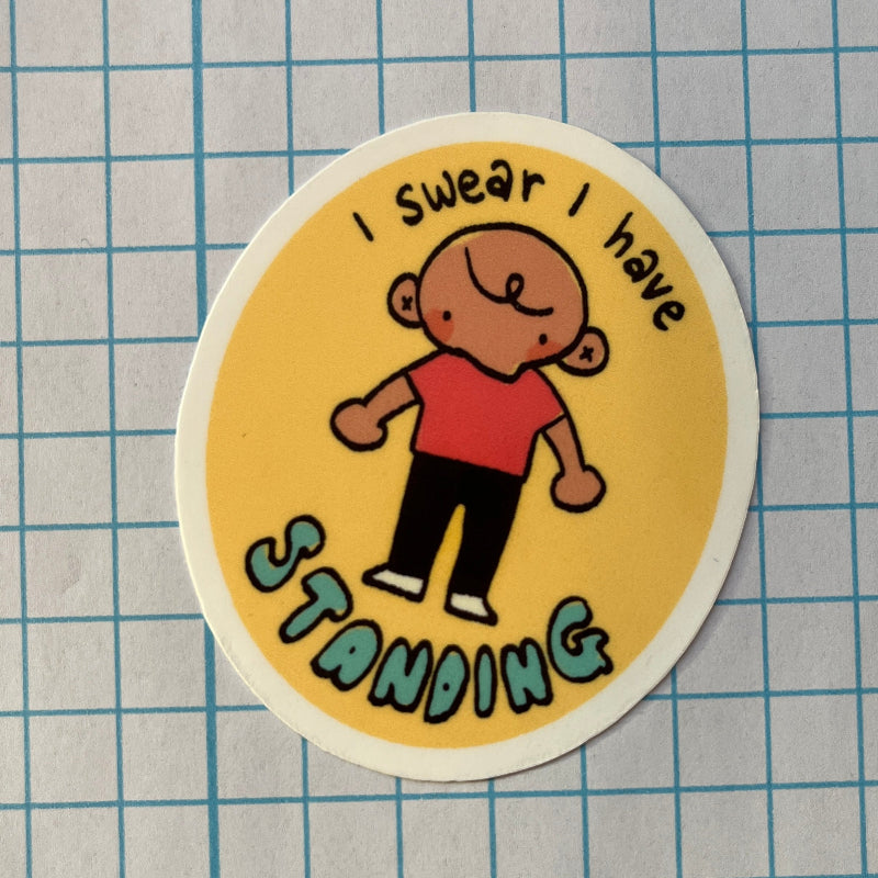 Round sticker with a cartoon character and text 'I swear I have standing' on a grid background